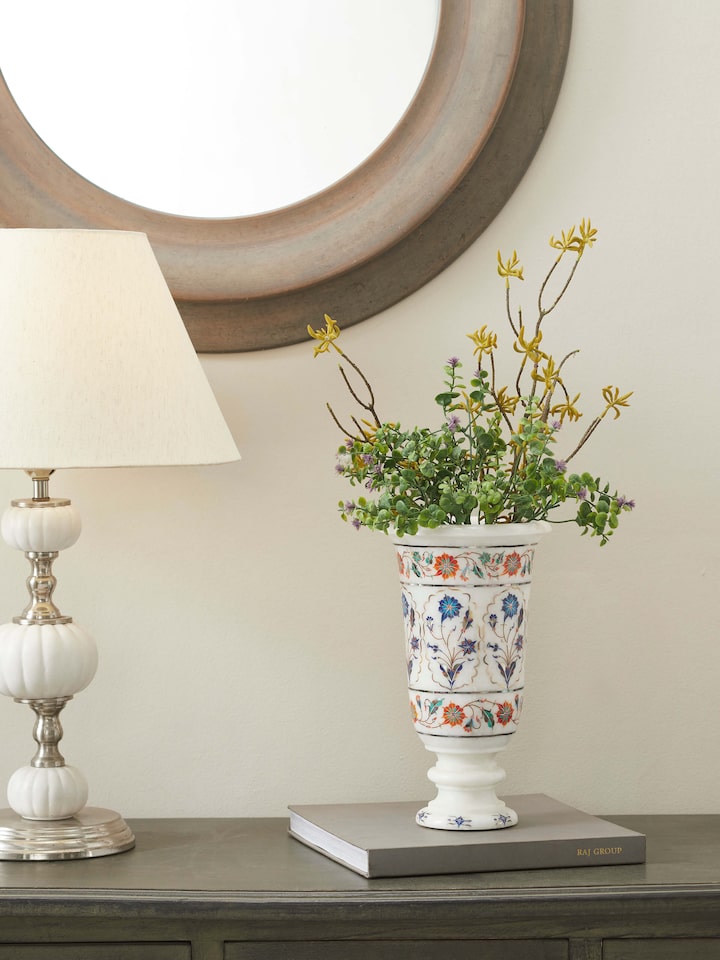 Close-up of Pacchikari marble floral table vase in white, highlighting the detailed floral carvings and elegant shape, Swadesh