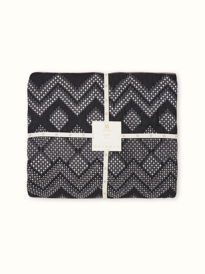 Angle view of Rambagh Grey Ombre Geo Cotton Sanganeri Block Printed Double Quilt displaying its gradient effect and design.