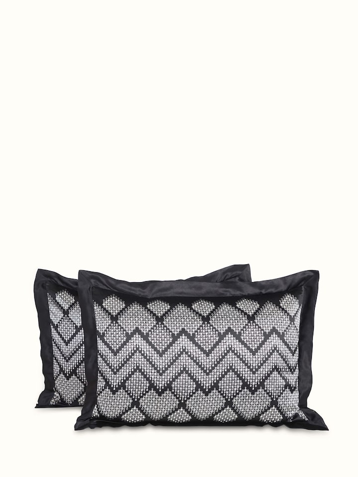 Rambagh geometric viscose cotton blend Sanganeri block printed double bedspread set, folded to show fabric texture.