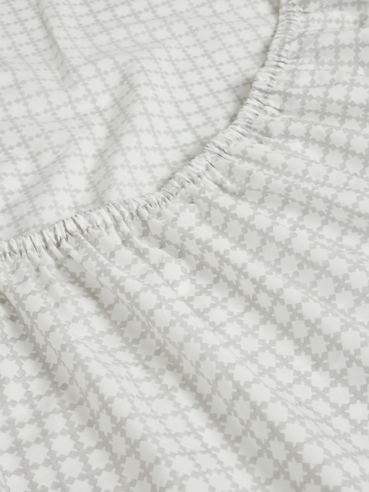 Detailed view of Pratidin grey grid cotton Sanganeri block printed queen fitted bedsheet set emphasizing the grid design and quality.
