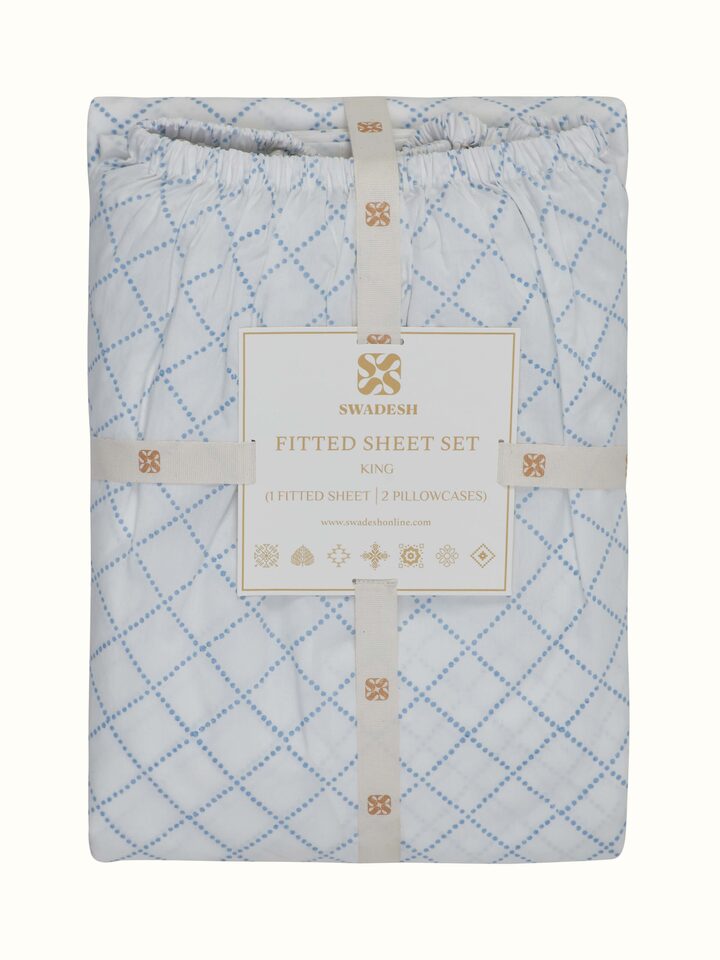 Angled view of Pratidin Light Blue Diamond Cotton Sanganeri Block Printed King Fitted Bedsheet Set, showcasing the overall pattern and color.