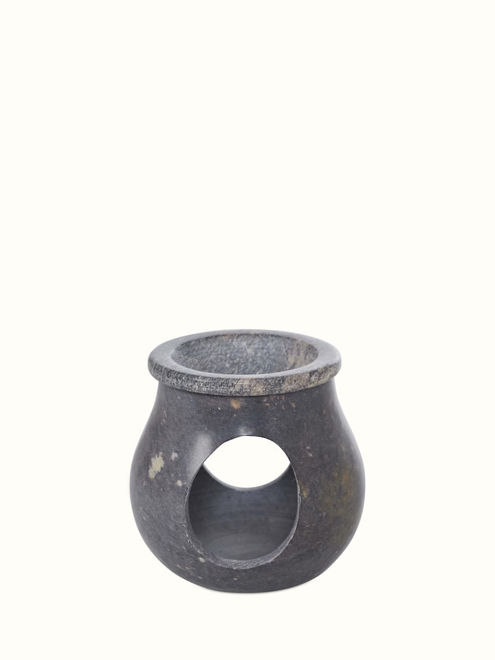 Back view of natural carved stone diffuser by Swadesh, showcasing the unique patterns and artistic craftsmanship.