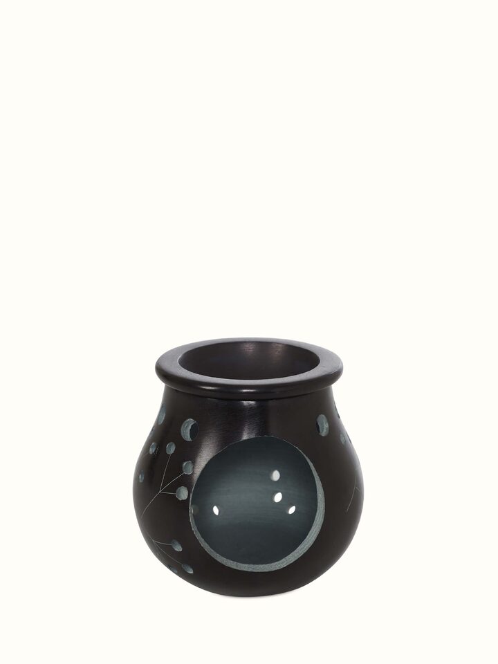 Close-up of Carved Stone Diffuser in Black Color, focusing on the carving details and smooth finish
