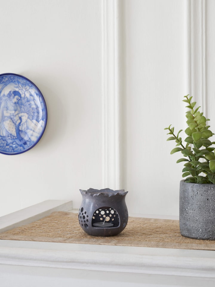 Side view of hand-carved stone diffuser.
