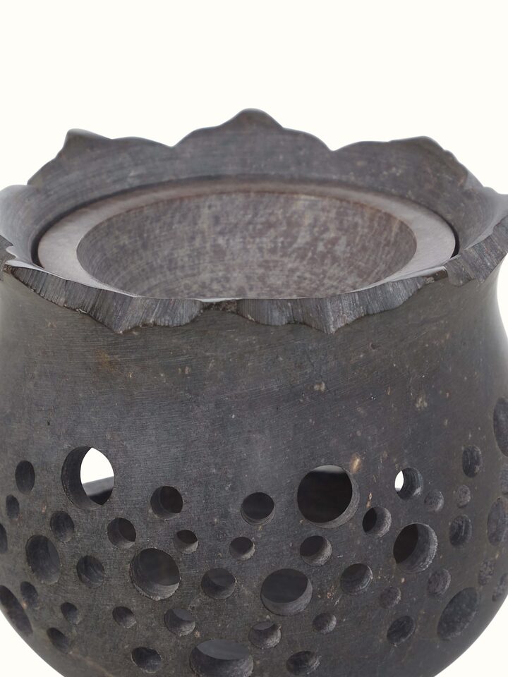 Close-up view of hand-carved stone diffuser.