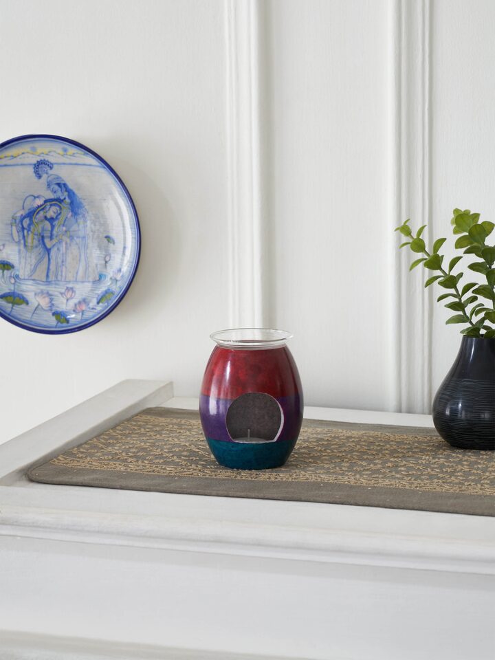 Side view of Carved stone diffuser in multicolor highlighting its craftsmanship