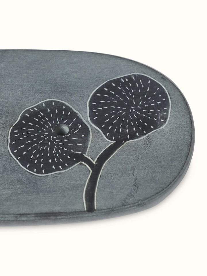 Detailed view of natural carved stone soap dish showing its textured surface and design.