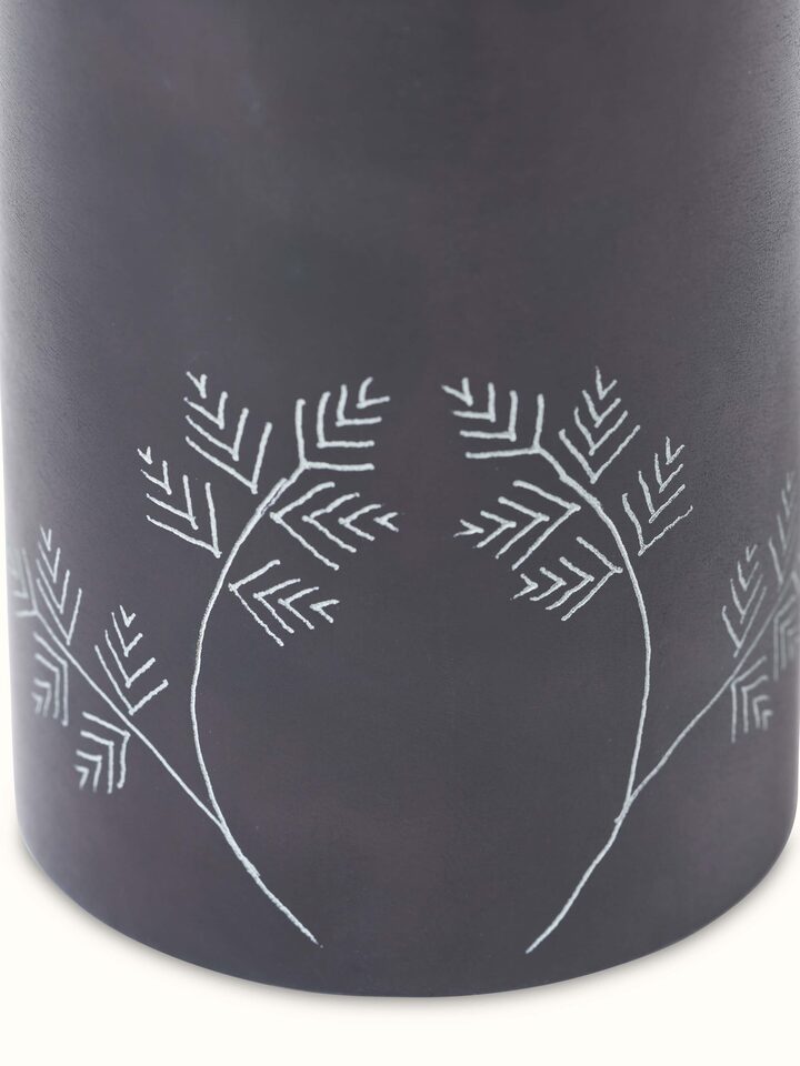 Detailed view of glossy carved stone toothbrush holder focusing on the fine carving details