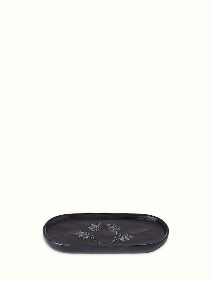 Detailed view of Carved stone bath tray focusing on the elegant patterns and natural stone texture
