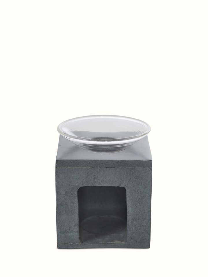 Angled view of Carved stone diffuser in grey color highlighting its elegant curves and detailed craftsmanship
