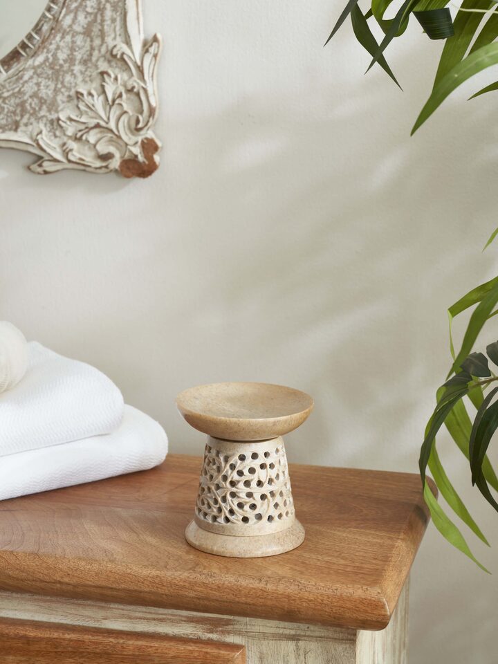 Side view of polished carved stone diffuser highlighting its elegant transitional craftsmanship