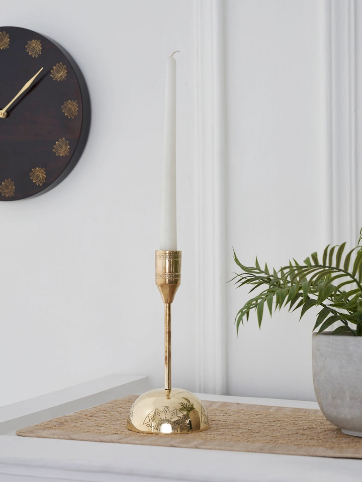 Side view of Polished brass candle holder