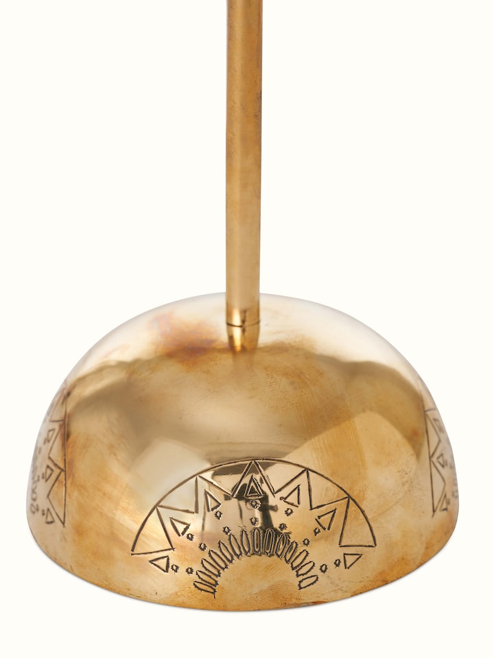 Angle view of Polished brass candle holder