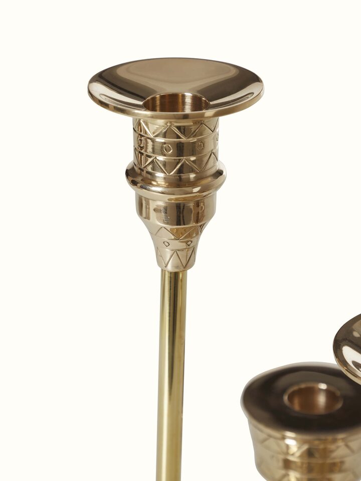 Angled view of grey brass candle stands (2 pcs), focusing on the sleek lines and modern aesthetics.