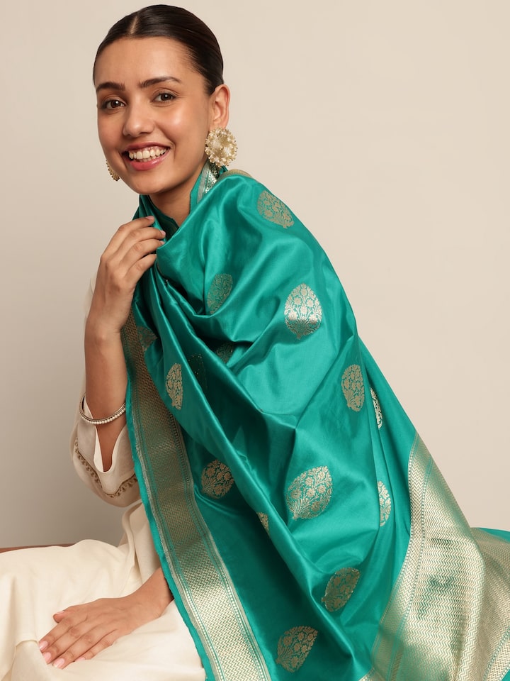 Angled view of light green silk Banarasi dupatta showing full length design