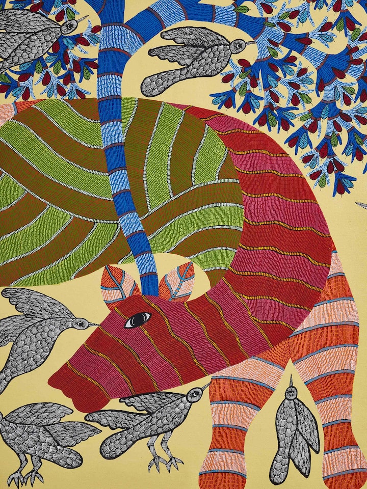 Close-up view of Gond Cow & Birds with Tree Painting by Swadesh showcasing the fine detailing and vibrant colors of the painting.