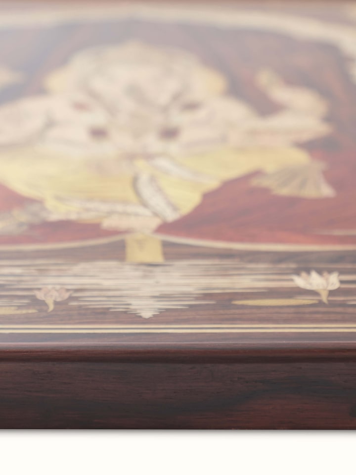 Close-up of Mysore Rosewood Inlaid Ganesha Wall Art emphasizing its intricate design and fine details.