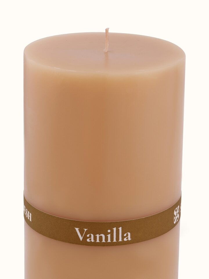 Rear view of Vanilla Pillar Candle (6 inches) displaying the candle's base and design.