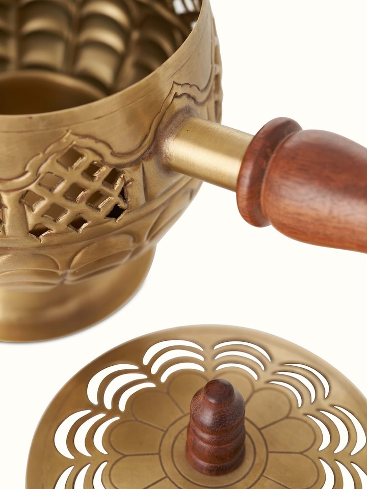 Detail view of Polished Brass Dhuna highlighting the fine metalwork and decorative elements.