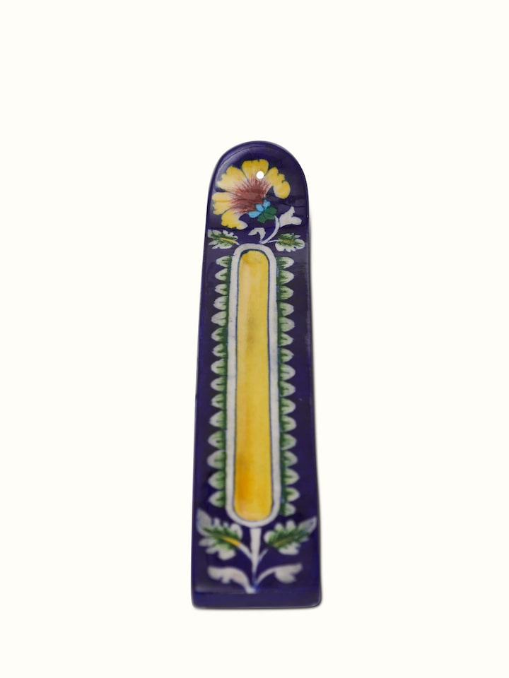 Front view of blue pottery stoneware leaf incense holder featuring its artistic leaf design and vibrant color.
