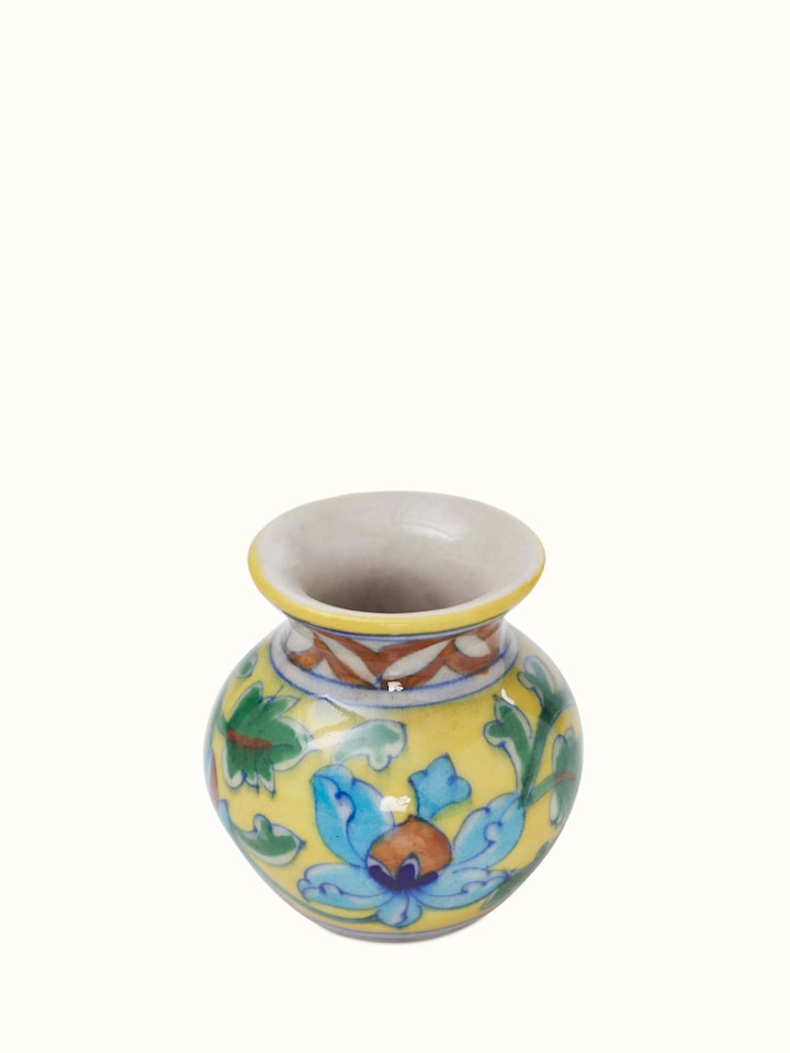 Polished blue pottery stoneware pooja thali set, displaying vibrant blue color and intricate designs.