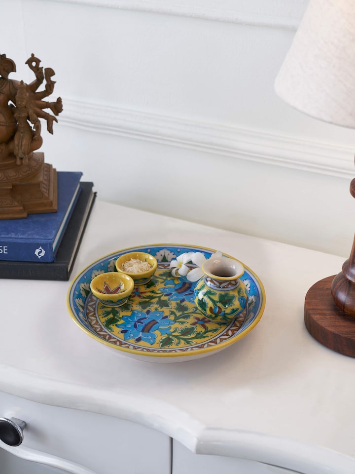 Close-up view of polished blue pottery stoneware pooja thali set, highlighting the fine blue pottery details.