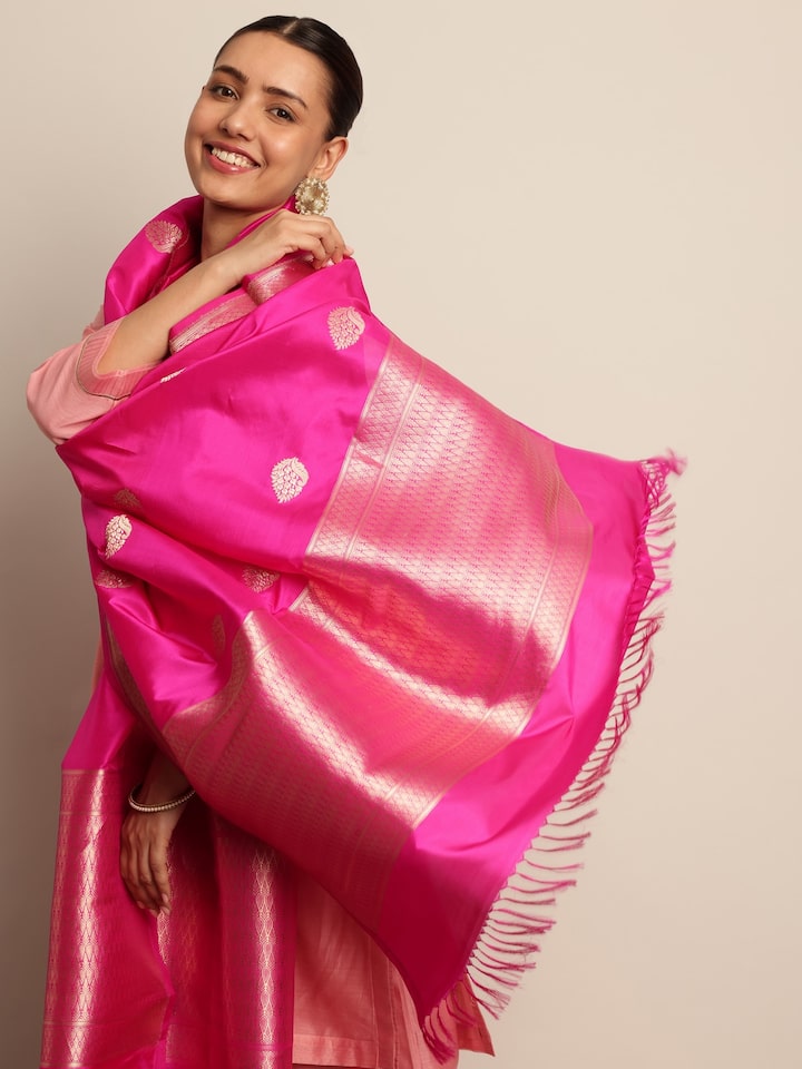 Angled view of pink silk Banarasi dupatta highlighting rich texture and zari border.