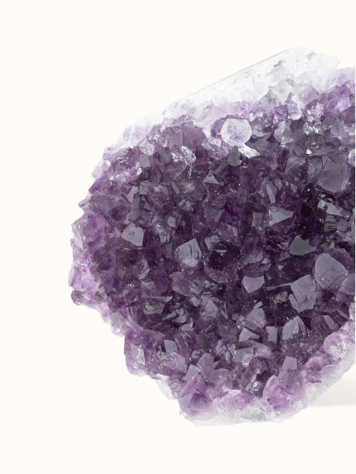 Detailed side view of large Amethyst geode healing stone highlighting its intricate crystal formations and texture
