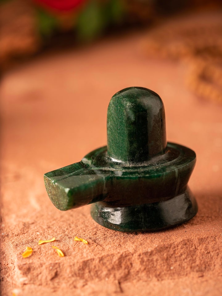 Side view of Jade Shivling (Medium) highlighting the intricate design and polished surface of the jade.