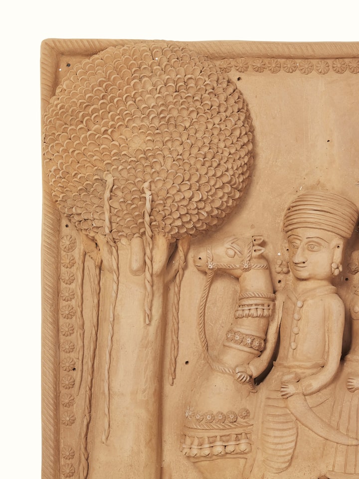 Side view of Terracotta clay Dhola Maru sculpture highlighting its traditional design