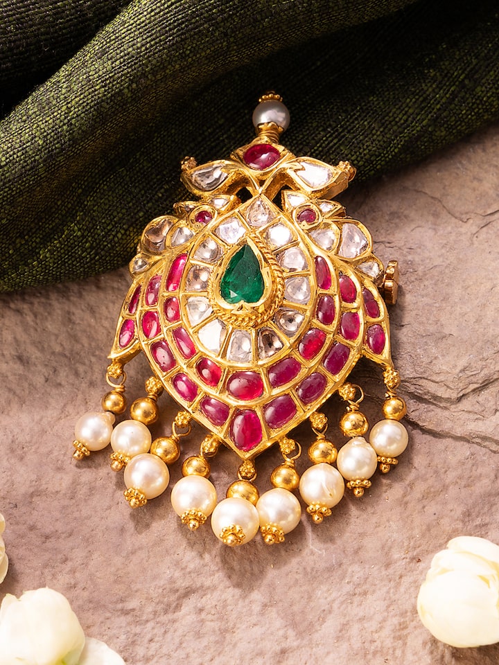 Lifestyle shot of Jadau brooch pin showcasing heritage-inspired look with luxurious detailing