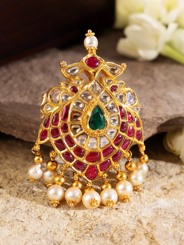 Side view of Hyderabad Jadau brooch pin with elegant floral pattern and rich texture