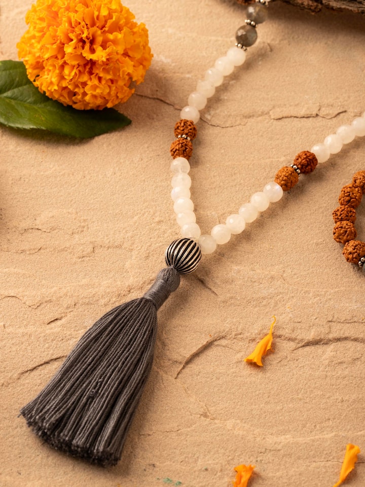 Close-up of Labradorite, White Moonstone & Rudraksha Silver Mala, focusing on the beads and silver details.