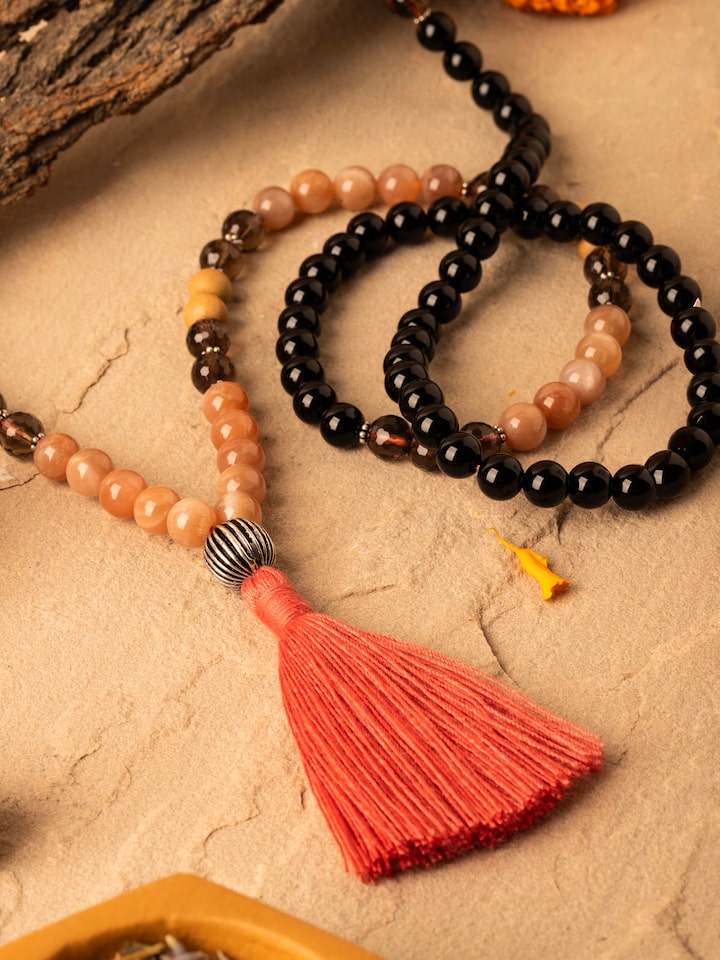 Side view of Smoky Quartz, Red Onyx, Peach Moonstone & Rudraksha Silver Mala showing the length and bead arrangement