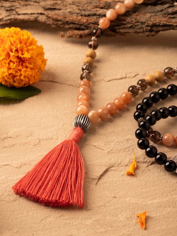 Detailed view of Smoky Quartz, Red Onyx, Peach Moonstone & Rudraksha Silver Mala focusing on the texture of the gemstones and rudraksha beads