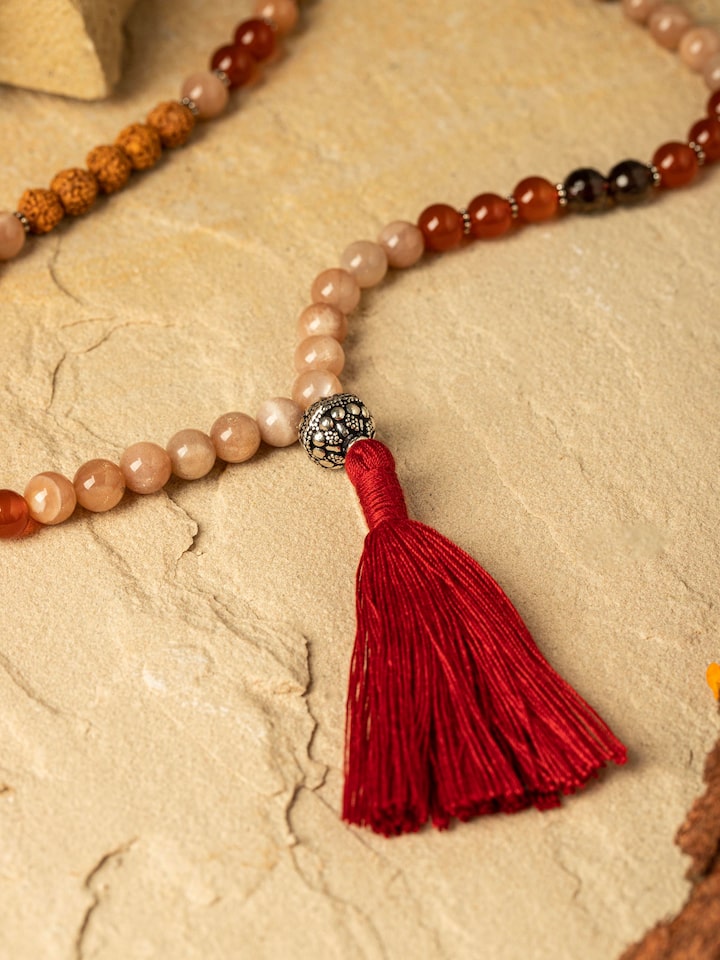 Side view of Smoky Quartz, Black Onyx & Peach Moonstone Silver Mala emphasizing the length and bead texture