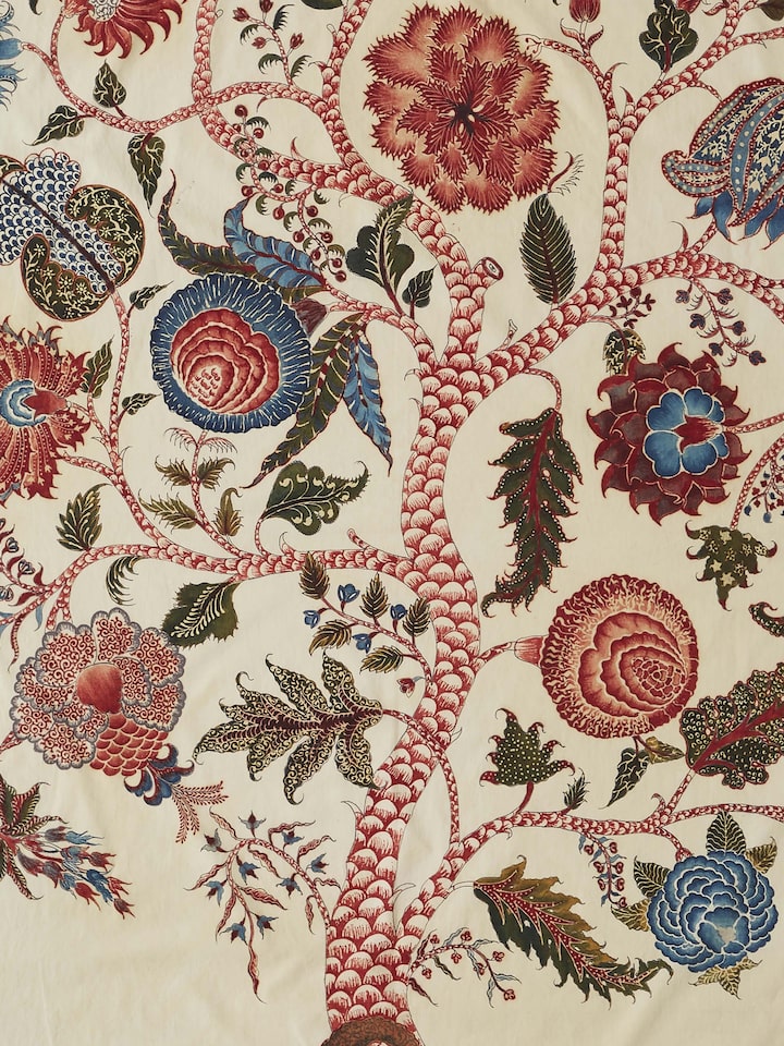 Close-up of Kalamkari divine tree painting showcasing fine brushwork and vibrant hues.