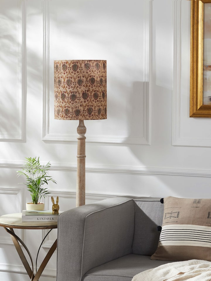Close-up view of Kalamkari block-printed cotton lampshade in fawn color, highlighting intricate designs and texture.