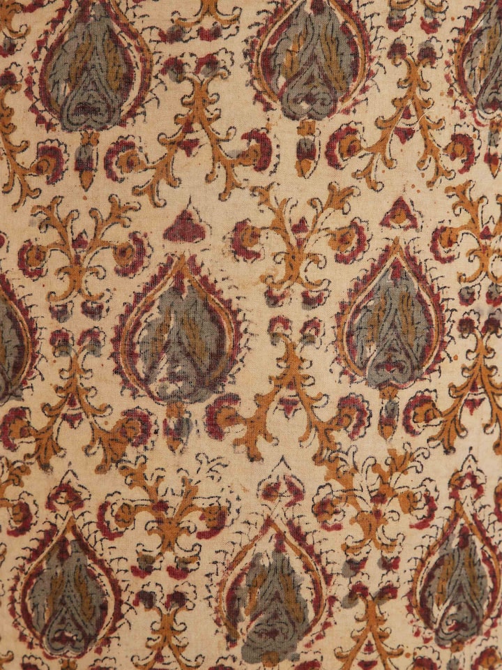Side view of Kalamkari block-printed cotton lampshade in fawn color, showcasing its elegant shape and artistic block print.
