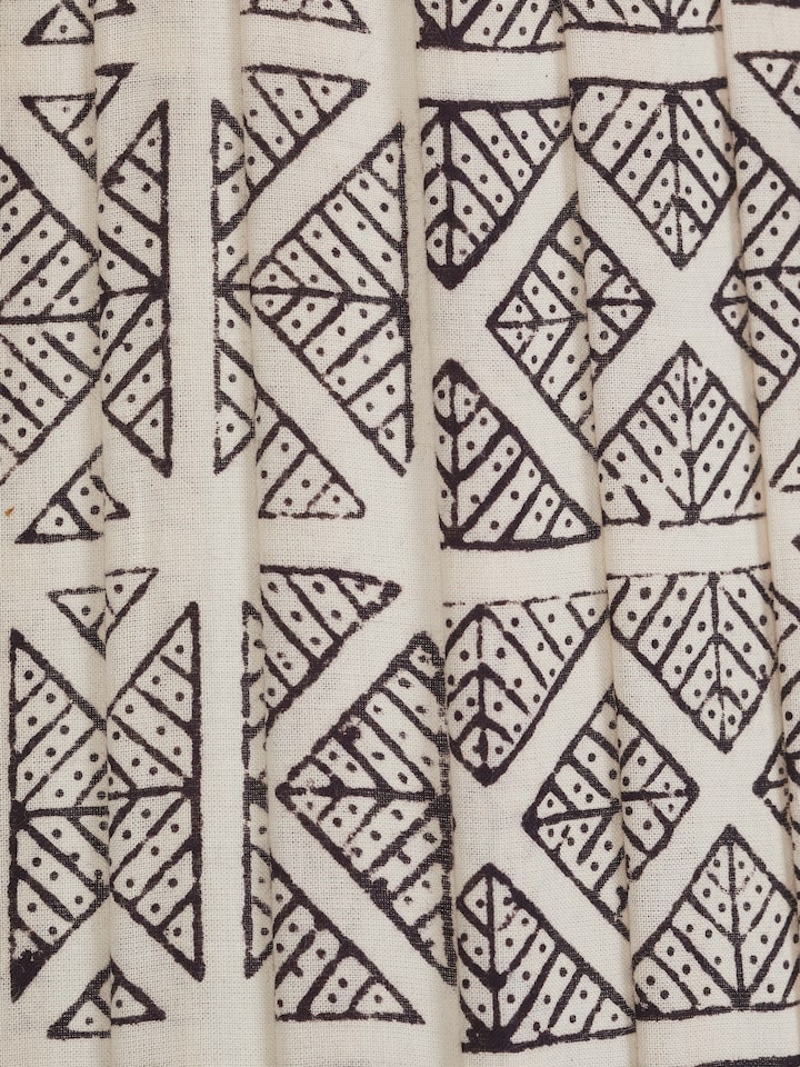 Close-up view of Bagh block-printed cotton lampshade in monochrome highlighting the fine details of the print