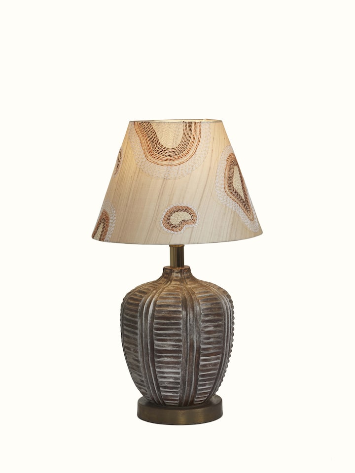 Angled view of Sujani embroidered cotton lampshade in brown color emphasizing its design