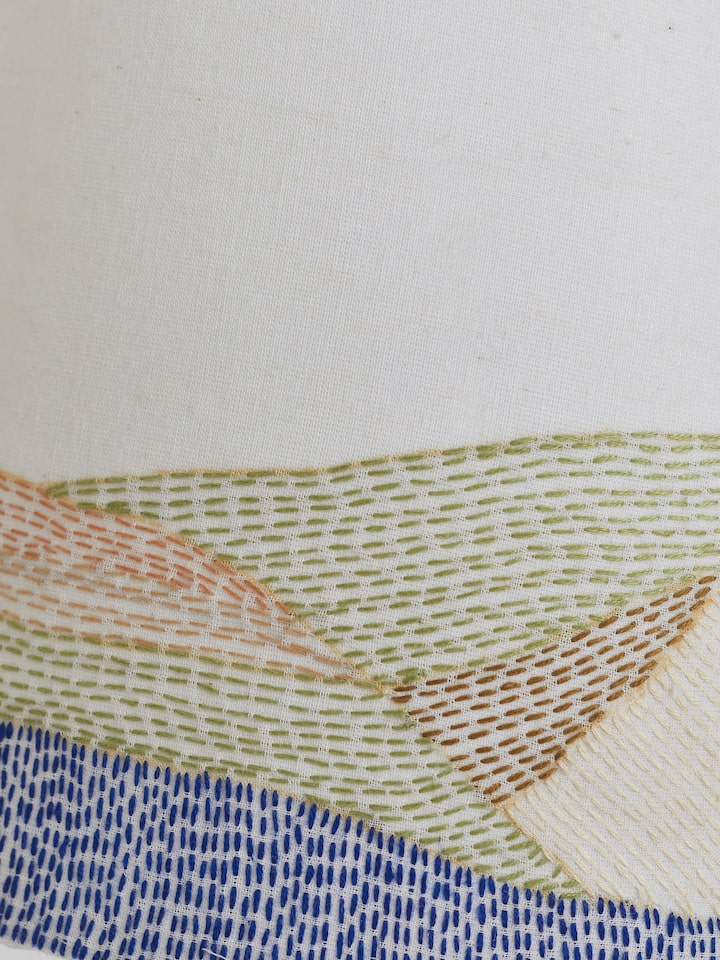 Detail view of Sujani Embroidered Cotton Lampshade in medium white color focusing on the intricate embroidery work.