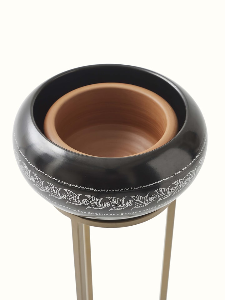 Close-up of Traditional Black Pottery Ceramic Planter highlighting its texture and craftsmanship.