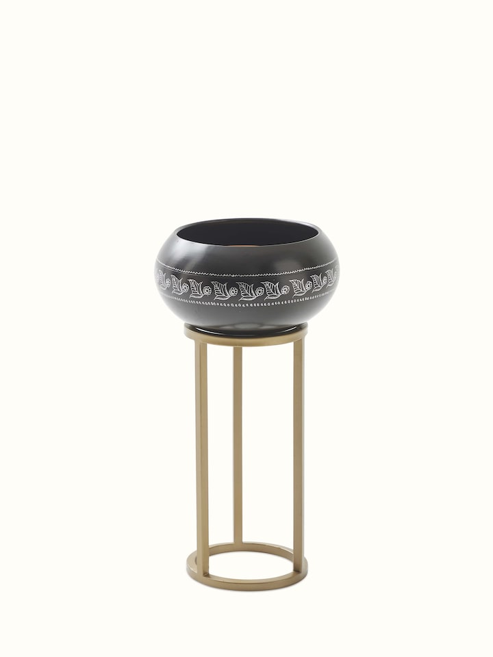 Top angle of black pottery ceramic planter displaying its unique shape and texture
