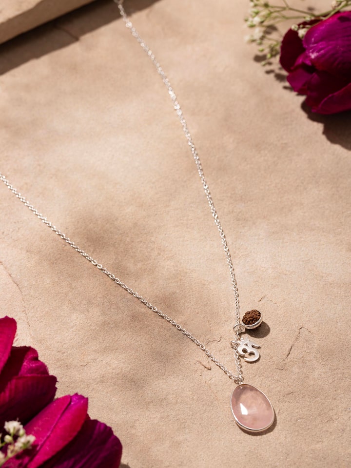 Side view of Rose Quartz, Om Silver Charm & Rudraksha Sterling Silver Necklace, highlighting the charm's placement on the chain.