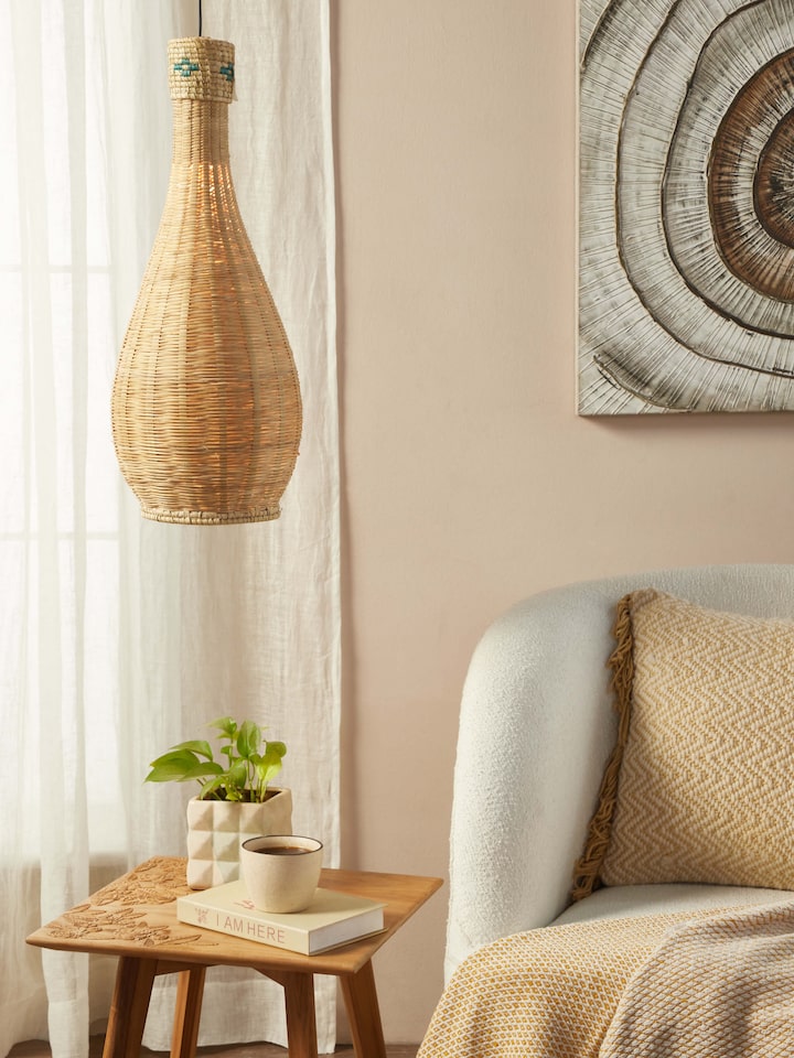Side view of Kanshi Basketry Natural Fibre Pendant Light, highlighting the detailed basketry and unique design.