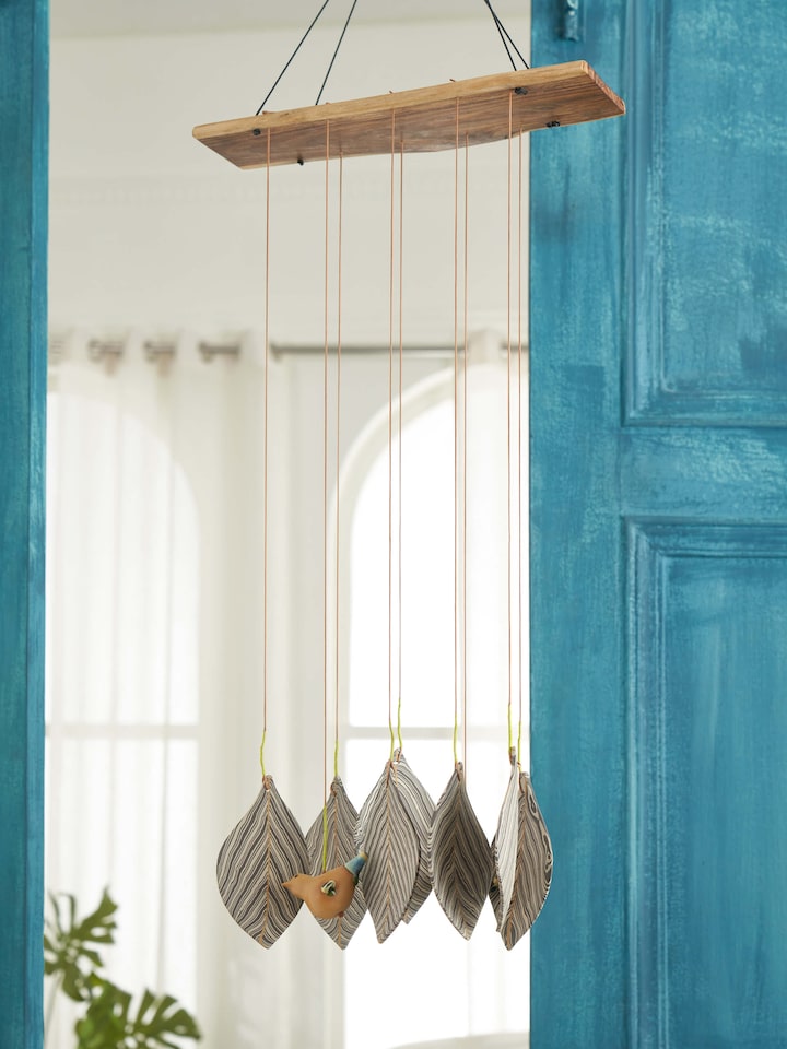 Side view of Harmonious ceramicware clay wind chime highlighting its delicate craftsmanship