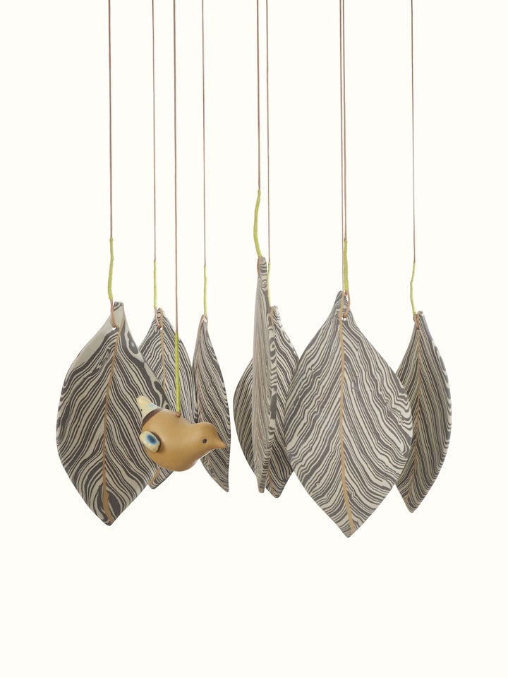 Close-up of Harmonious ceramicware clay wind chime showcasing intricate details and textures