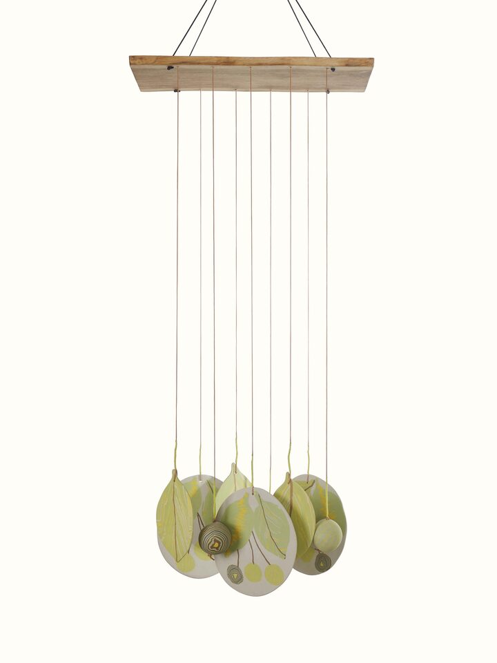 Side view of Melodious Ceramicware Clay Wind Chime, highlighting the detailed ceramicwork and hanging design.