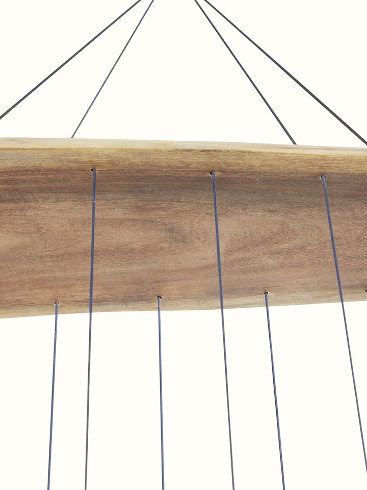 Symphonic ceramicware clay wind chime with close-up of the detailed design and finish.